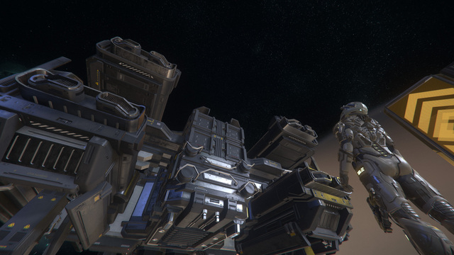 Image: The looming building-like facade of engines on the rear of the MOLE blend into the dark of space.